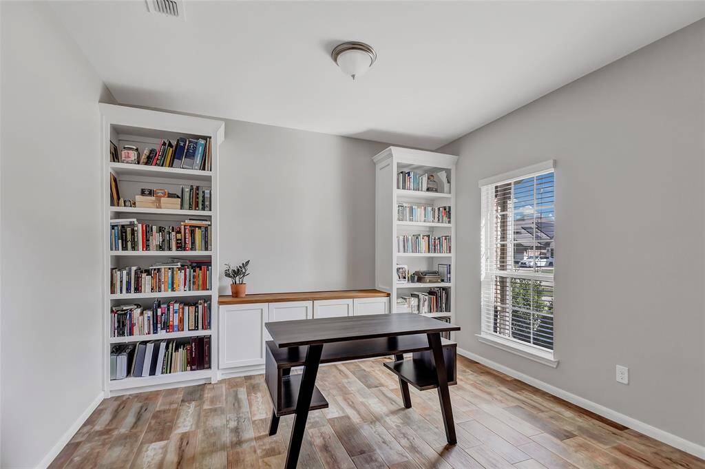 Built in bookshelves and cabinets in the office