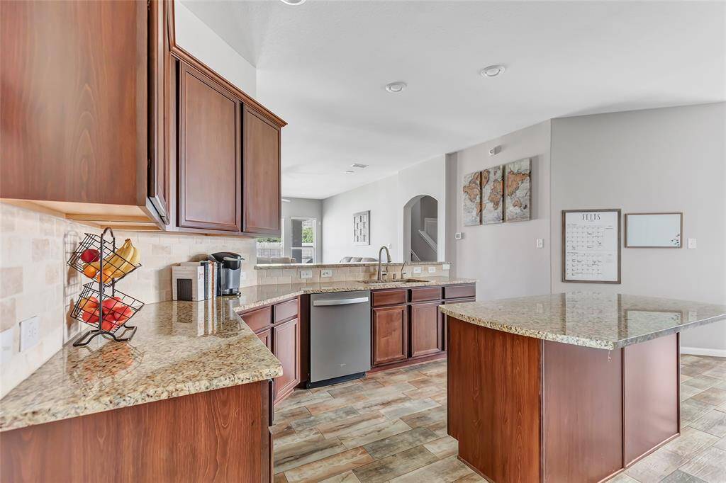 Huge kitchen with oversized island opens to the living room