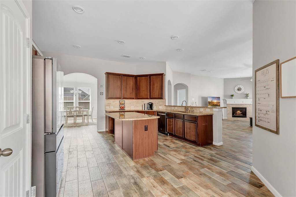 Huge kitchen with oversized island w/ a view of the dining room