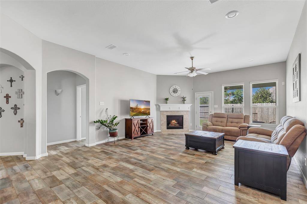 Living room with entrance to the primary suite to the left