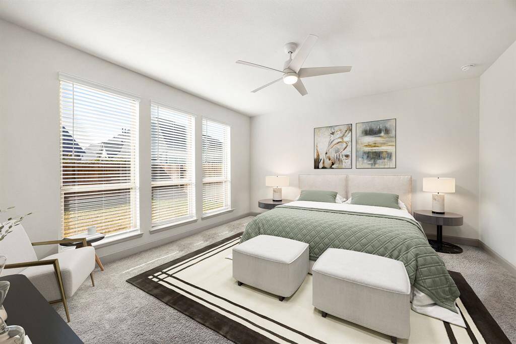 What a wonderful place to come home to, this stunning primary suite greets you with plush carpet, a warm custom paint, high ceiling, ceiling fan with lighting, and large windows allowing in natural light brightening up this spacious primary bedroom, with extra space for a seating area. *Virtutally Staged