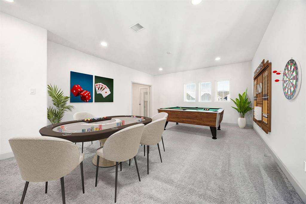 Come upstairs and enjoy a day of leisure in this fabulous game room/media room! This is the perfect hangout spot or adult game room, this space features plush carpet, high vaulted ceiling, recessed lighting, custom paint and storage closet. *Virtually Staged
