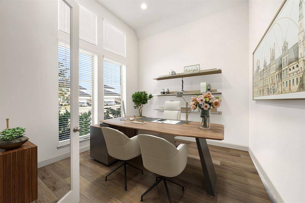 Nestled away quietly in the front of the home is the handsome and grand home office. Featuring high ceilings, custom paint, wood-like flooring, recessed lighting and large windows with plenty of natural light. *Virtually Staged