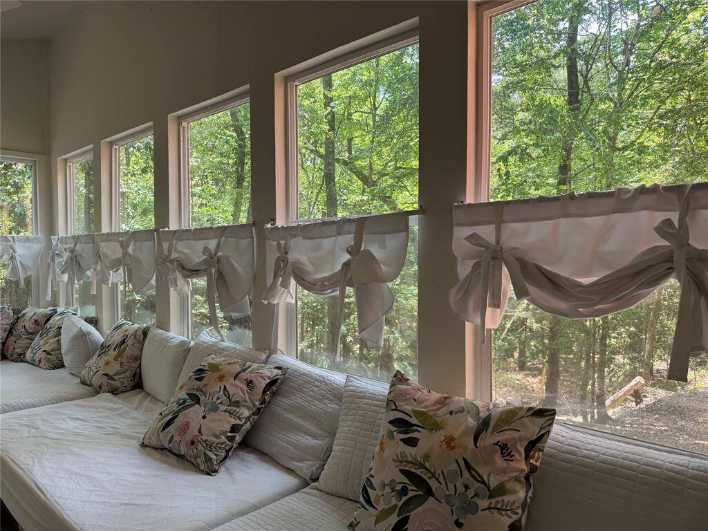 Wall of windows overlooking the property
