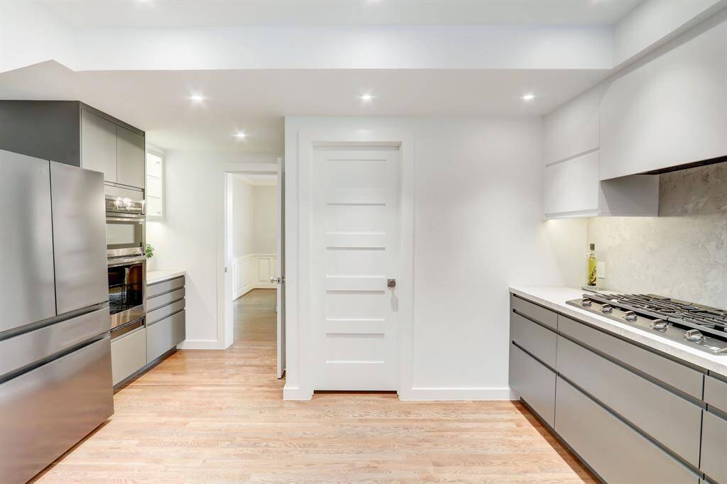 Primary kitchen has a spacious feel with all stainless appliances, gas range and walk-in pantry.