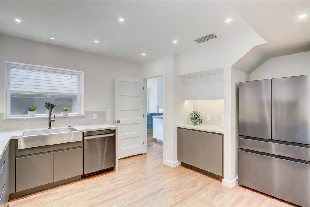This wide window over the sink allows nice light to come in making this space cozier than ever.