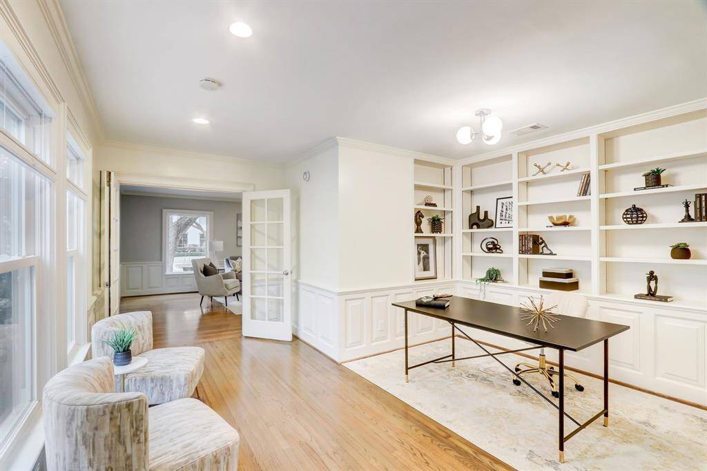 This home office space gets great light and the bookcase in the back would make a great backdrop for Zoom conference calls.