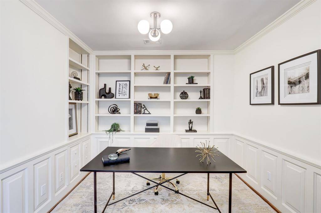 Have fun adding your personal touch to this office space with books or decor.