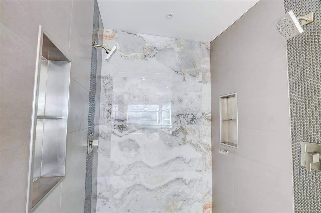 Two built-in storage spaces for his and her bathroom accessories.