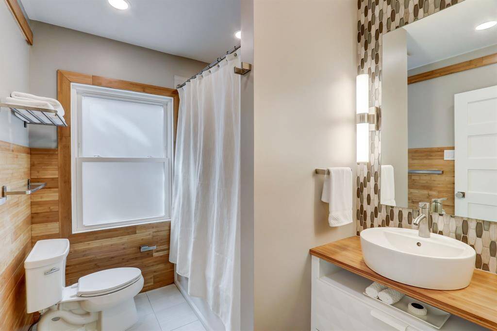 Upstairs full bathroom for two of the nearby secondary rooms. This bathroom also offers a spa-like feel to both guests and residents alike.