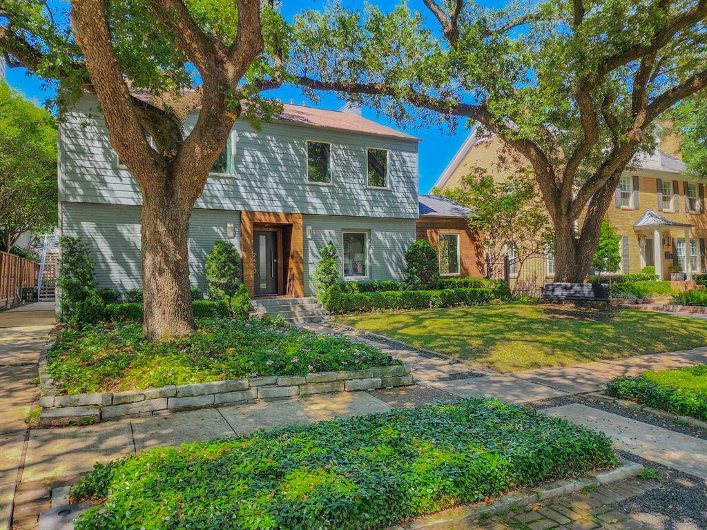 Upon pulling up to this home you are greeted by the well-manicured landscaping, swinging chair and 100 year old trees that provide ample greenery and shade from the sun.