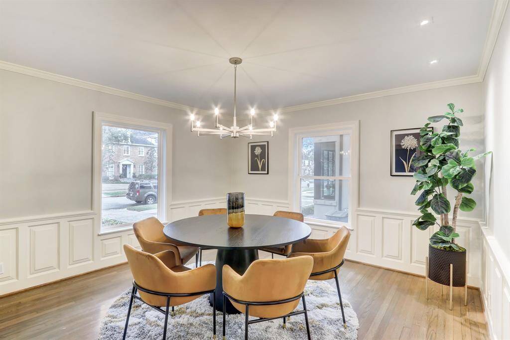 Paneling and spacious open room make this dining area a great place to host dinner parties or entertain.