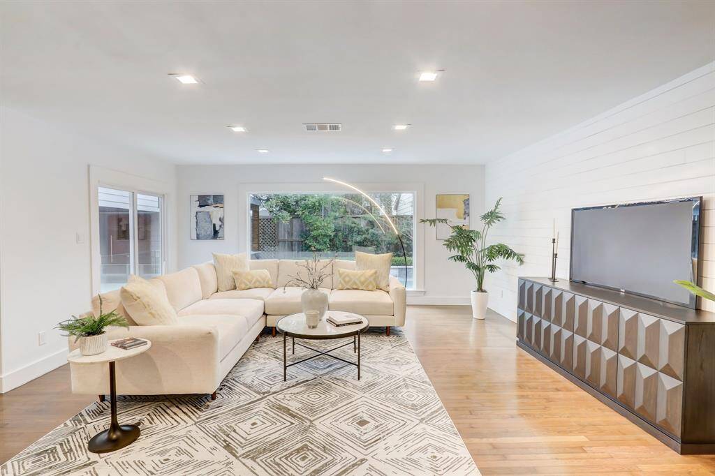 This living space has spacious windows and overlooks the pool space making this a very light filled and vibrant room.