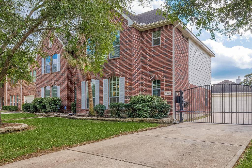 Wrought iron gate provides privacy and security, creating an extra play area for the family.
