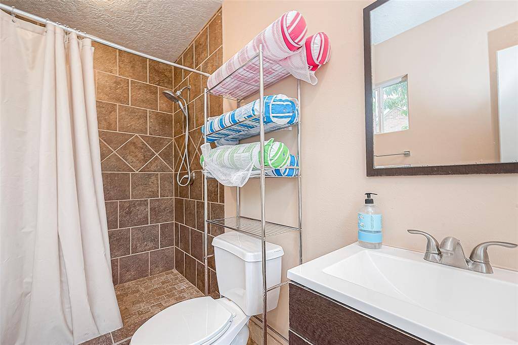 Full pool bath has a full shower and hot water is located outdoors at the back of the garage - so convenient for outdoor enthusiasts!