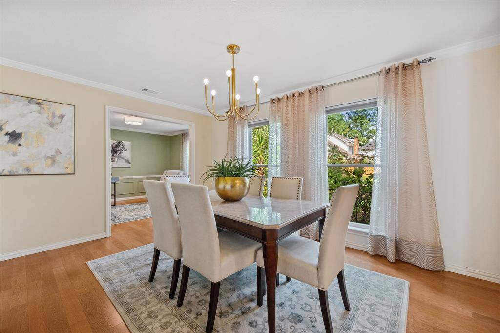 Originally built as Contiguous Formals.... Formal living and Dining.... Seller put their Dining area off the Foyer as pictured. Room behind it (off the kitchen) is being used as a Home Office/Study.