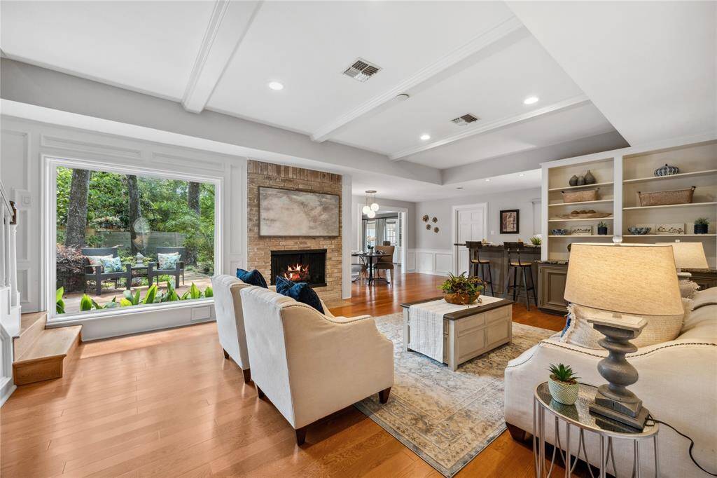 And WOW! What a Gorgeous Family room to walk into! Check out this HUGE picture window (All Double Pane Pella Windows by the way...) Note the view of the deck and back yard... in addition to this lovely room!