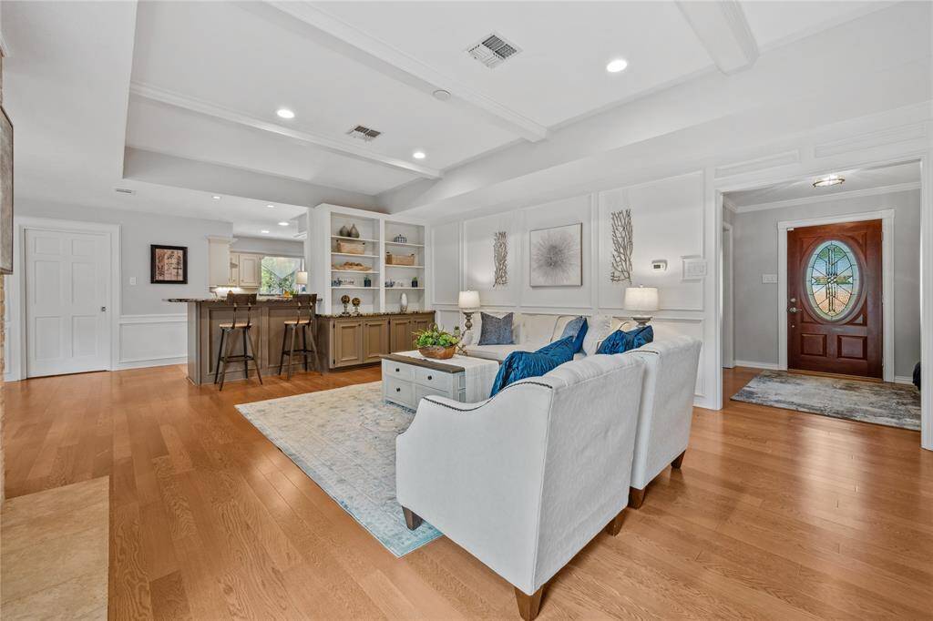This Family Room angle shows the Cabinetry, shelving and Bar Stool area off the Kitchen....STAGING TEXAS  with Cheryl Mosley did a FANTASTIC JOB of Staging this wonderful home!!!