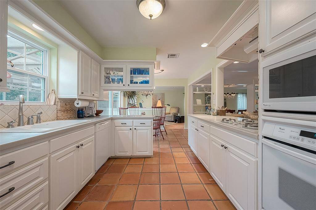 Another kitchen view from utility room to breakfast room & den