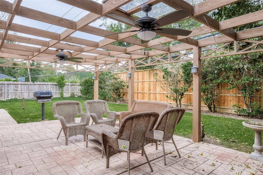 Another patio view with grill showing backyard space