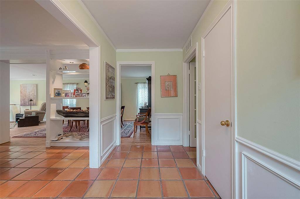 Front door hallway looking at dining room & den