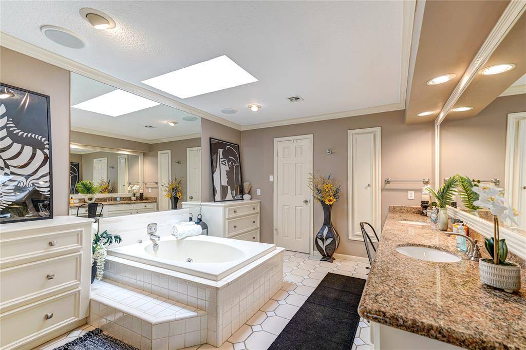 Primary bathroom with jacuzzi tub and shower