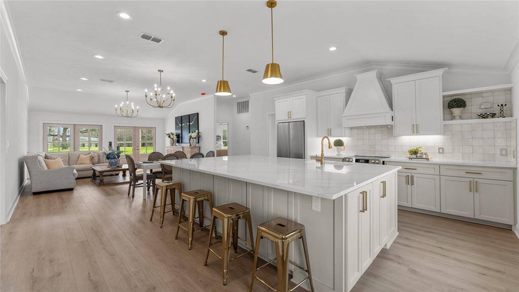Welcome home to 2619 FM 2187 Road, located just minutes from downtown Sealy, TX!Upon entering the home, you're welcomed into a beautifully renovated interior that seamlessly combines contemporary finishes with rustic elements. The kitchen has been completely remodeled with high-end appliances, quartz countertops, elegant backsplash, and custom cabinetry with gold hardware. It's a chef's dream, offering ample space for meal preparation and storage, as well as a massive island that doubles as a breakfast bar.