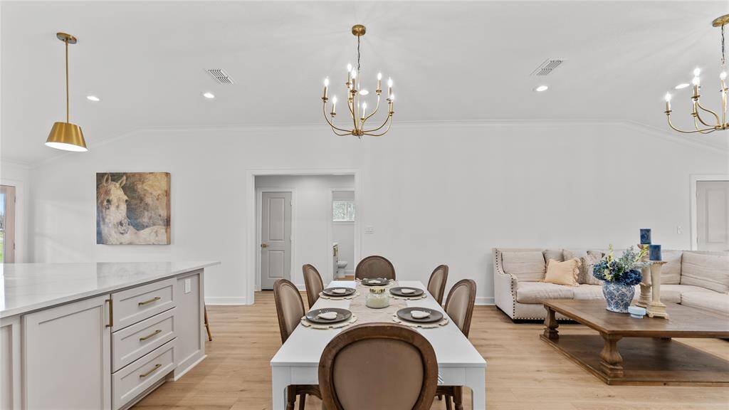 Come together with family andfriends in the open-concept dining room fordelicious meals! With its convenientaccess to the kitchen and living area,entertaining is a breeze. The elegant gold chandelier that catches youreye!