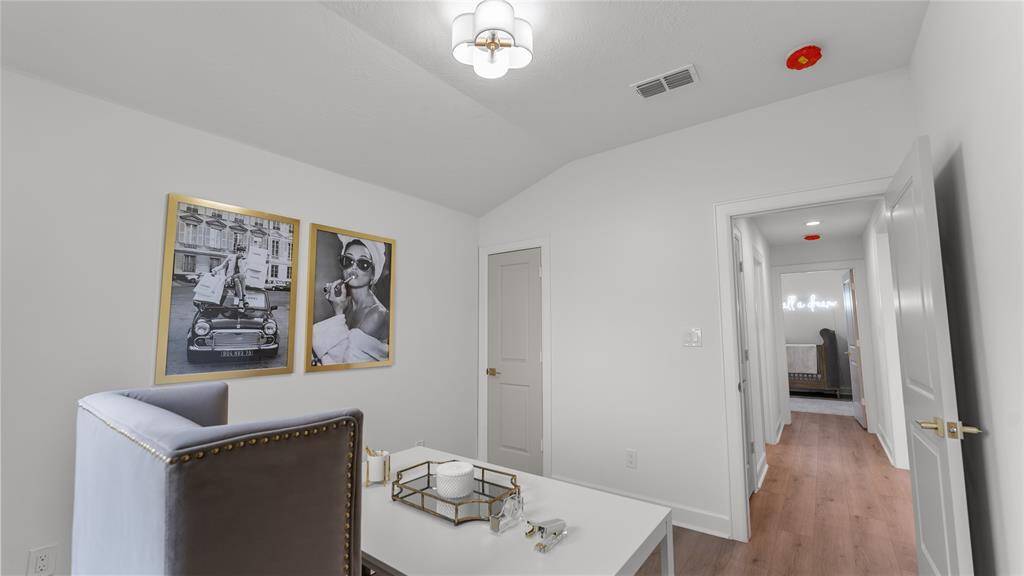 This spacious room currently shown as an office. offers functionality, and comfort, making it the perfect space for tackling tasks, fostering creativity, and achieving your professional goals. Whether you're working from home or pursuing passion projects, this well-appointed space provides everything you need to thrive in your endeavors.