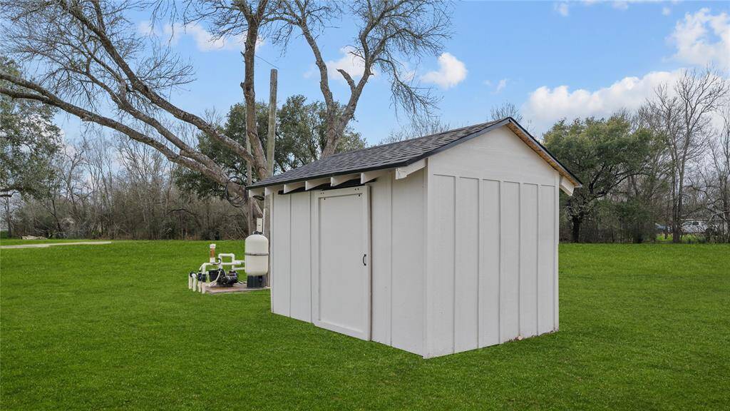 The well house also has been freshly remodeled to match the home, while providing protection and shelter for the equipment that supplies clean, fresh water. The pool equipment is located just behind the well house.