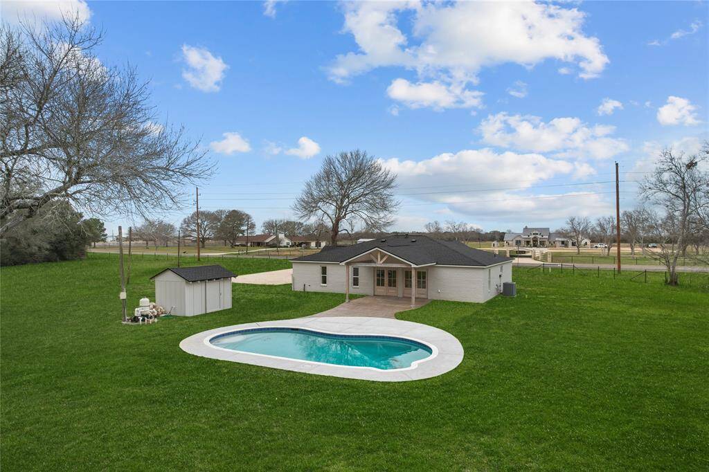 Surrounded by a spacious deck, this completely remodeled pool offers all new coping, tile, plaster and cool deck and is perfect for lounging in the sun, hosting poolside gatherings, or simply taking a refreshing dip on a hot summer day. Beyond the pool area, the property extends into sprawling acres of land, providing endless opportunities for outdoor recreation and exploration.