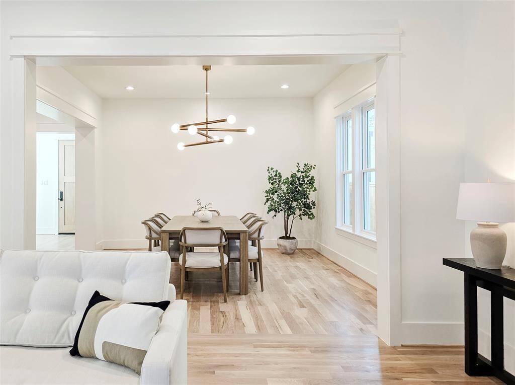 Spacious dining room comfortably fits an 8-person table.