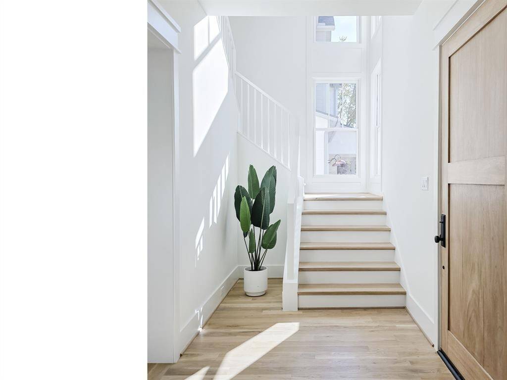 A one of a kind staircase bathed in natural light, offering a beautiful view at any time of day.
