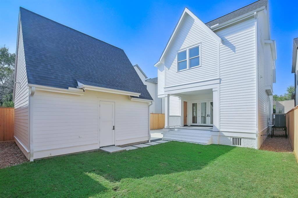 Spacious backyard with detached garage.