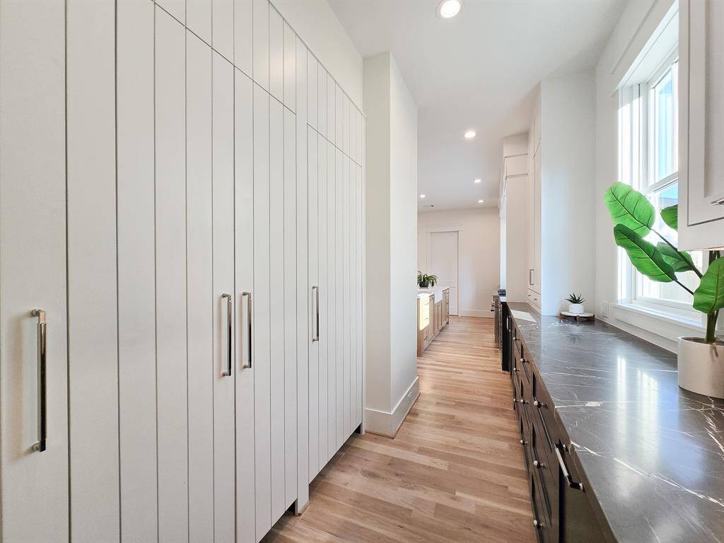The ideal kitchen extension, this scullery offers additional storage and workspace.