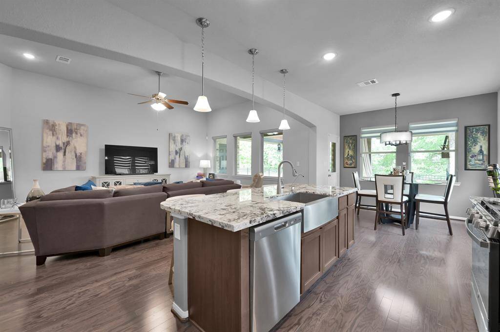 Wood flooring and neutral tones create a warm, inviting atmosphere.