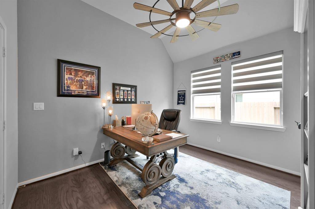 Another view of the office, the two large windows with Zebra shades enhance the natural light in this space.