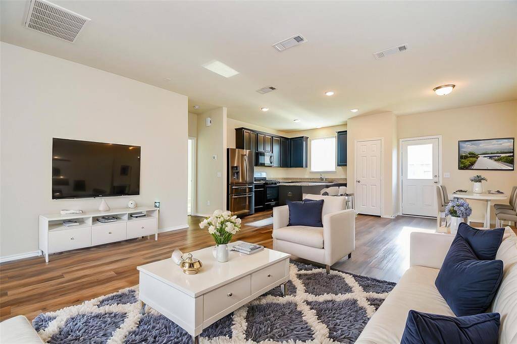 Picture the ease of entertaining with this open layout, offering seamless flow into other home areas.
