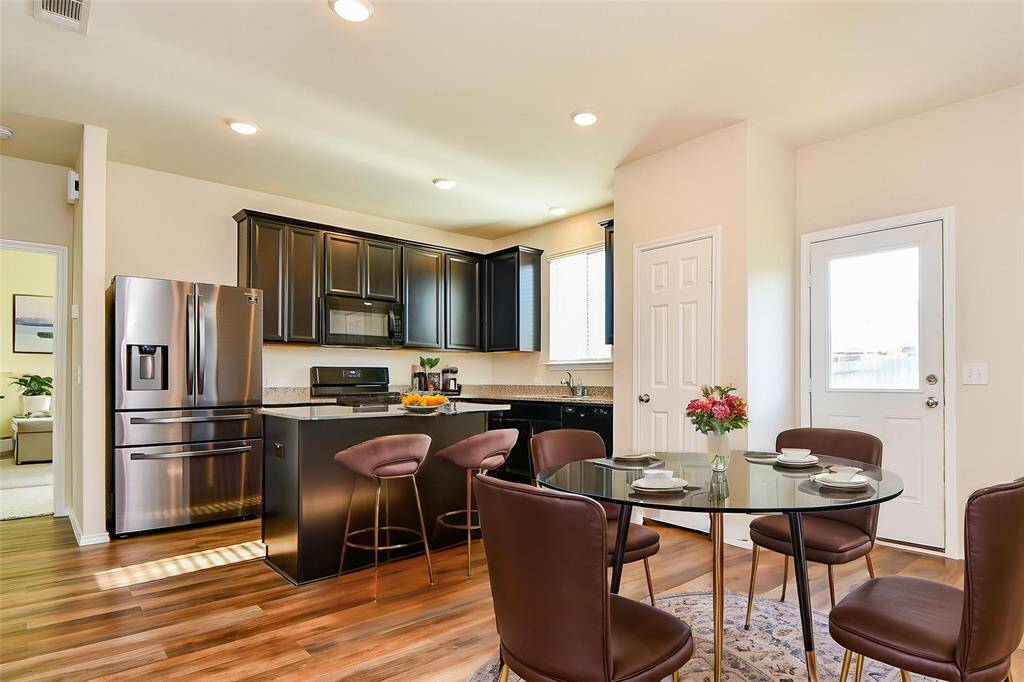 Discover a stylish and functional kitchen and adjacent dining nook, perfect for everyday living and entertaining.
