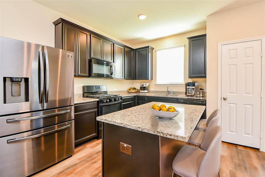 The elegant granite countertops provide a durable and beautiful workspace.