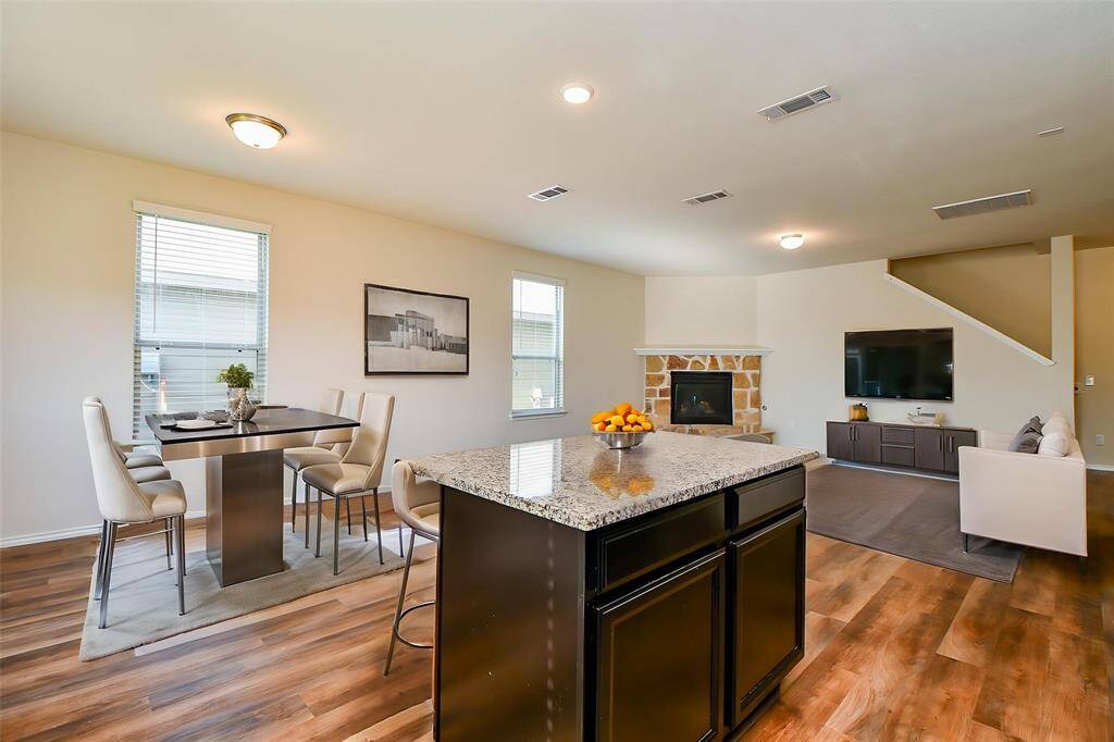 The central island offers a fantastic spot for meal preparation and casual interaction.