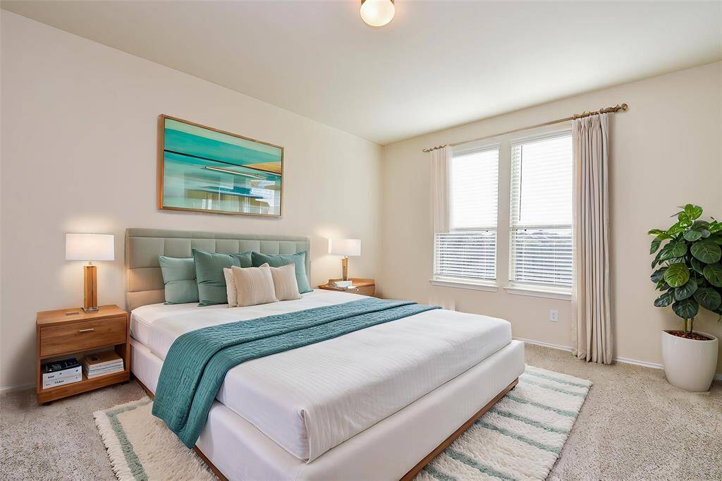 Retreat to this serene and spacious primary bedroom.