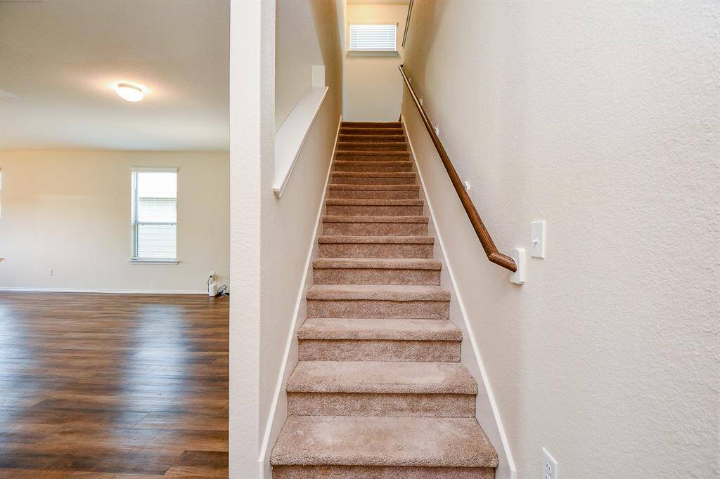 Ascend the welcoming staircase and discover the additional living spaces this home offers.