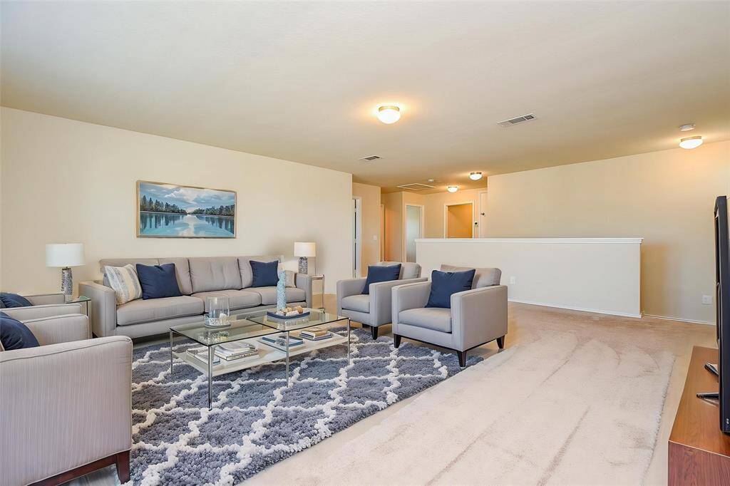 Notice the neutral walls and comfortable plush carpet, providing a versatile backdrop to complement your style.
