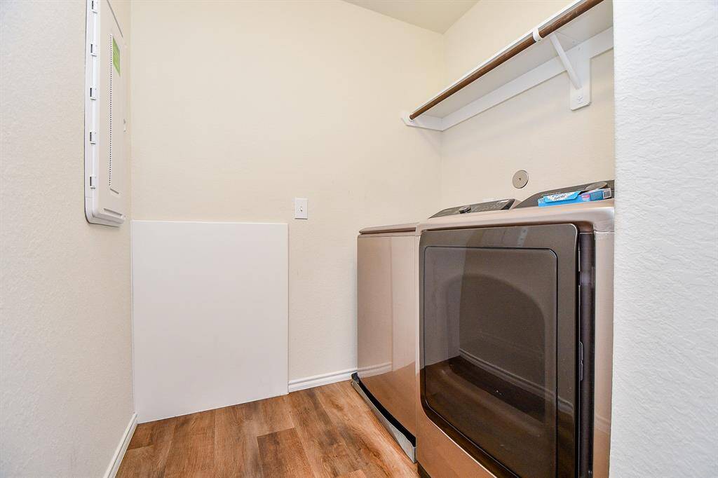 Discover the convenience of a dedicated laundry space.