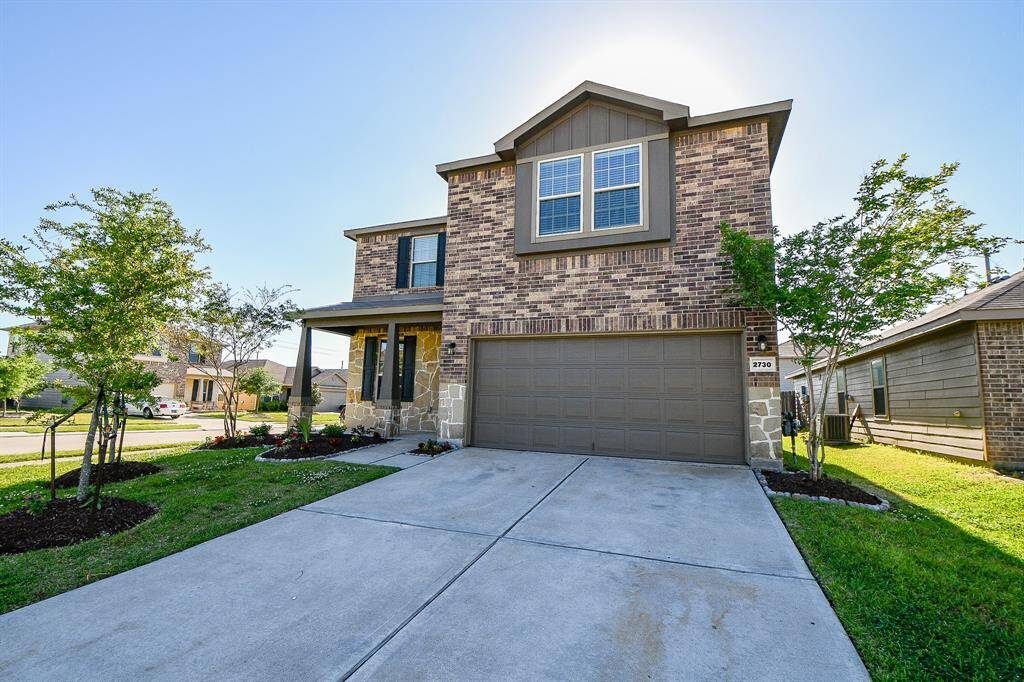 This is completed by a well-maintained front yard and fresh landscaping. The spacious two-car garage offers ample parking and storage.