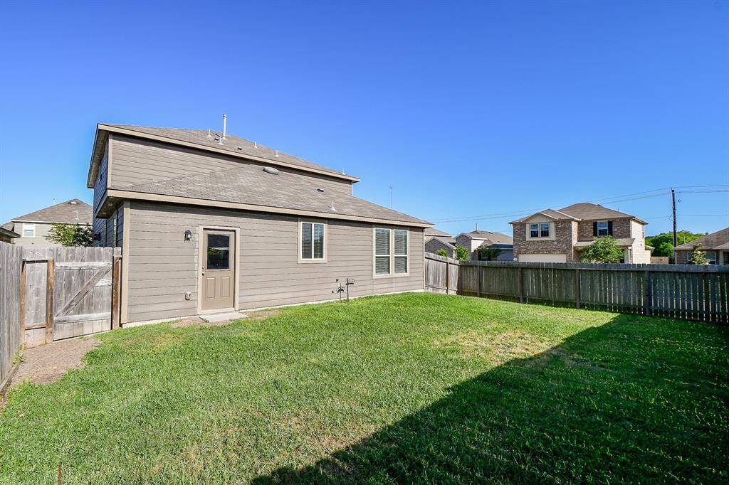 Notice the well-maintained lawn, providing a lush and inviting area for recreation and leisure. The secure fencing offers privacy and peace of mind.