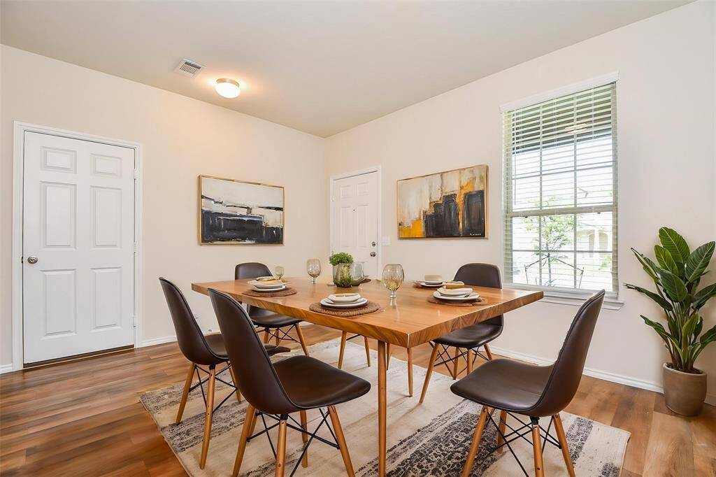 Imagine gathering in this bright, welcoming dining area, a perfect space for creating lasting memories.