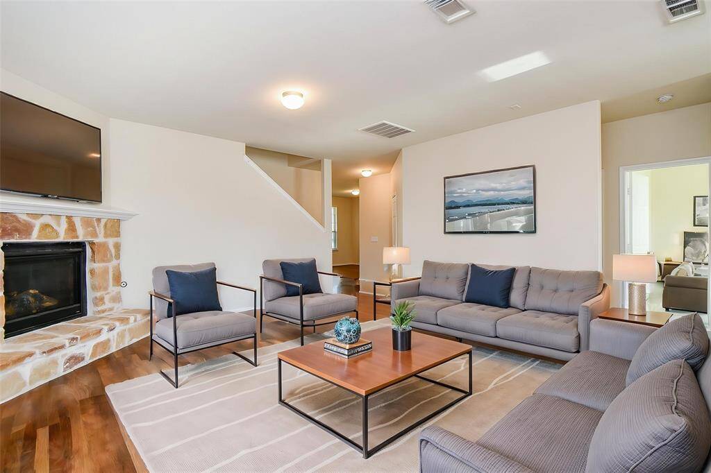 The charming brick fireplace is perfect for cozy evenings.