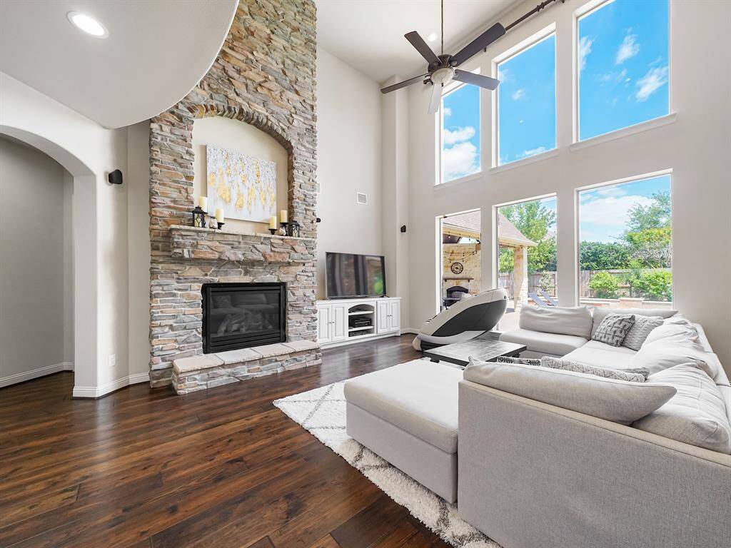 The living room seamlessly flows into the gourmet island kitchen, creating an open and inviting space for entertaining.